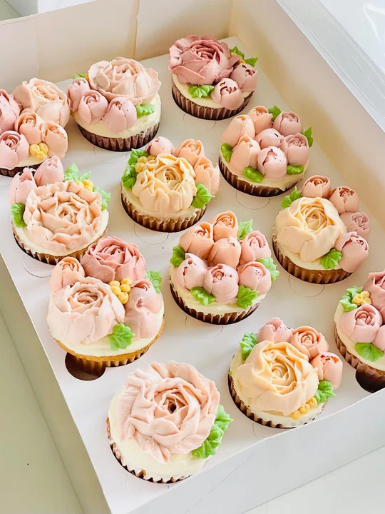 A box of buttercream flower cupcakes